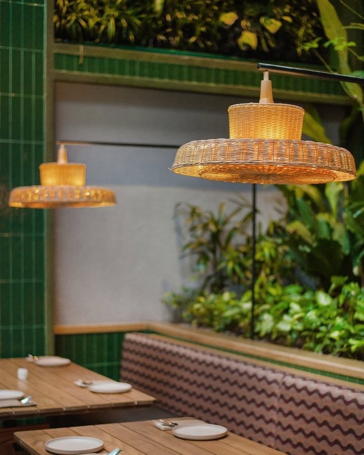 SEMAJA restaurant indoor garden Menteng Jakarta tiered seating greenery ISMAYA Group Nusantara cuisine modern dining 2026
