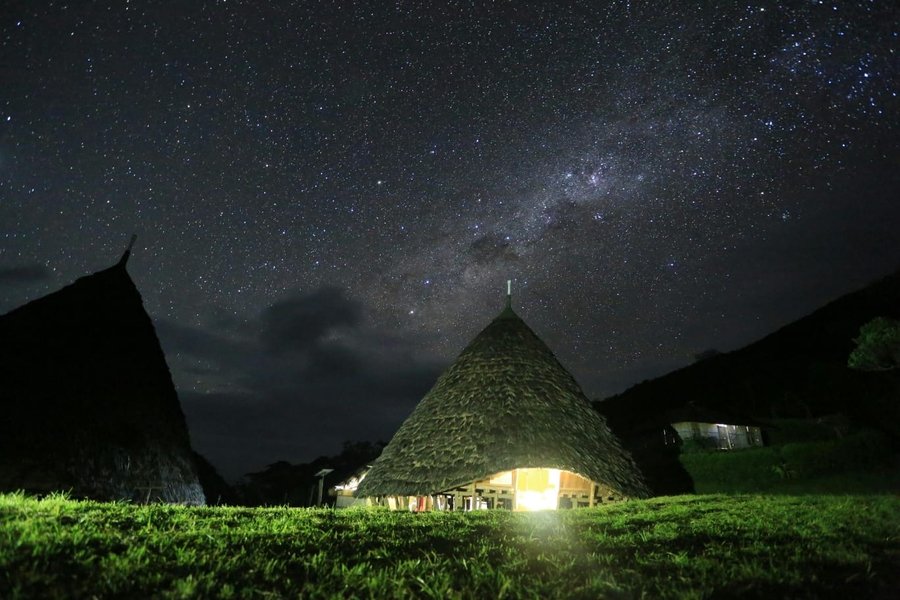 Wae Rebo Milky Way night sky Flores Indonesia Mbaru Niang silhouette cone shaped houses no light pollution dark sky Himalayas vibe