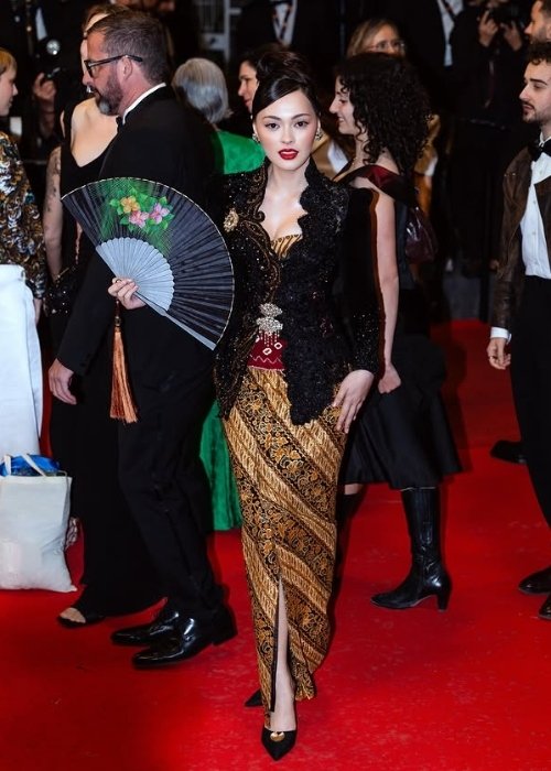 olene Marie at the Gentle Monster world premiere on May 15. Black kebaya by Intan Avantie. Indonesia on the Palme d'Or red carpet.]